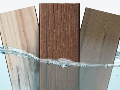 Half-immersed composite wood panels in water to demonstrate their waterproof quality.