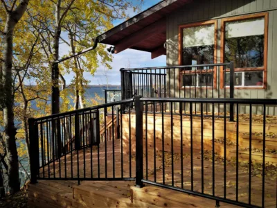 House with a lake view and black railing