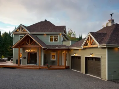 Beautiful country house with separate garage with forest on the background