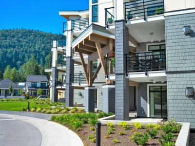 Modern condo complex with blue cladding.