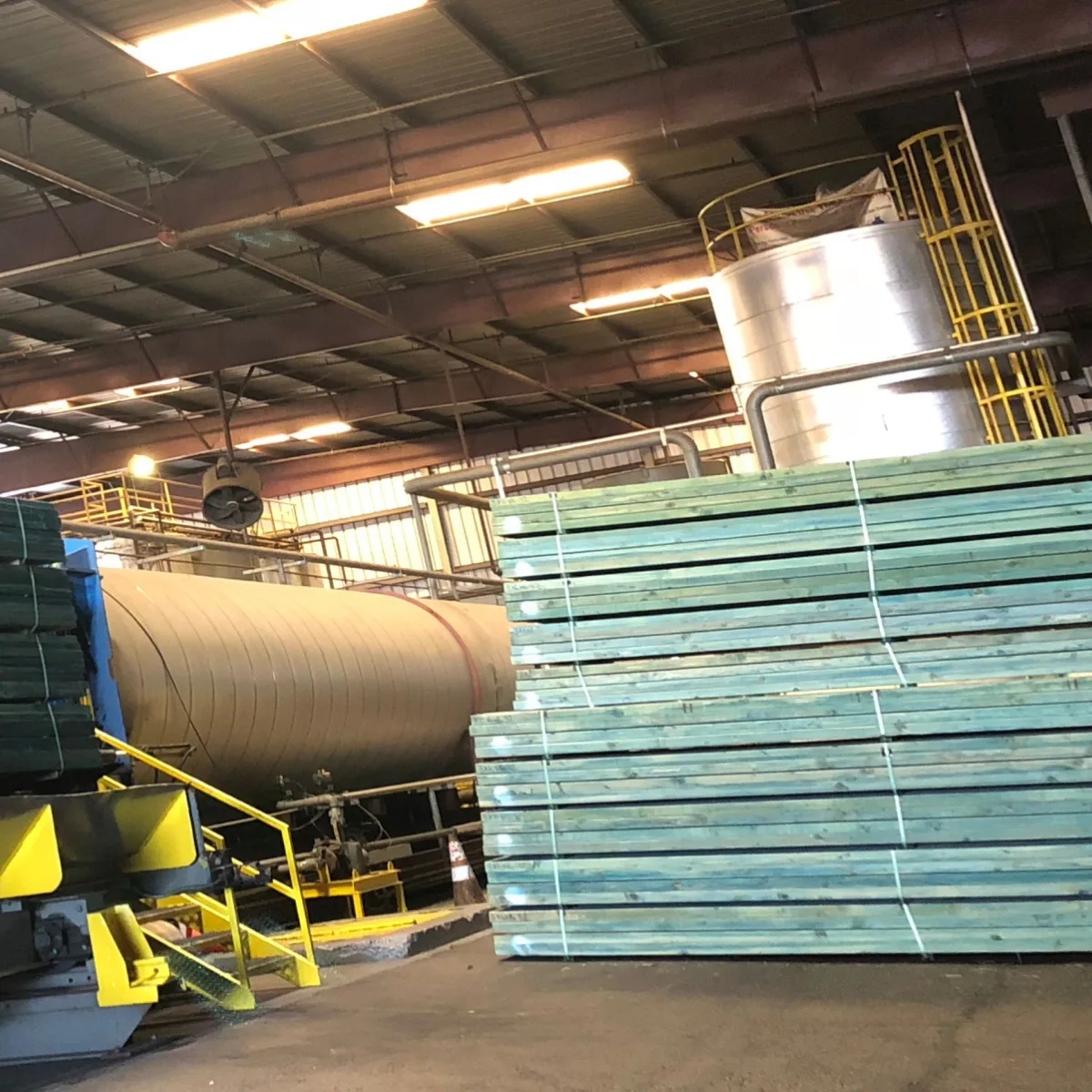 Perspective angle of wooden planks at a lumber warehouse.