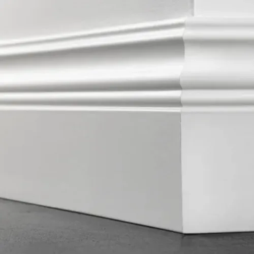 Close-up of a white decorative floor molding.