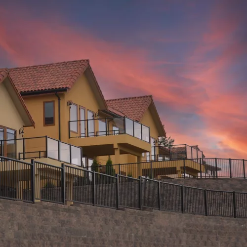 Century Aluminum Railings Glass Picket Combo railing on multi-dwelling stone wall